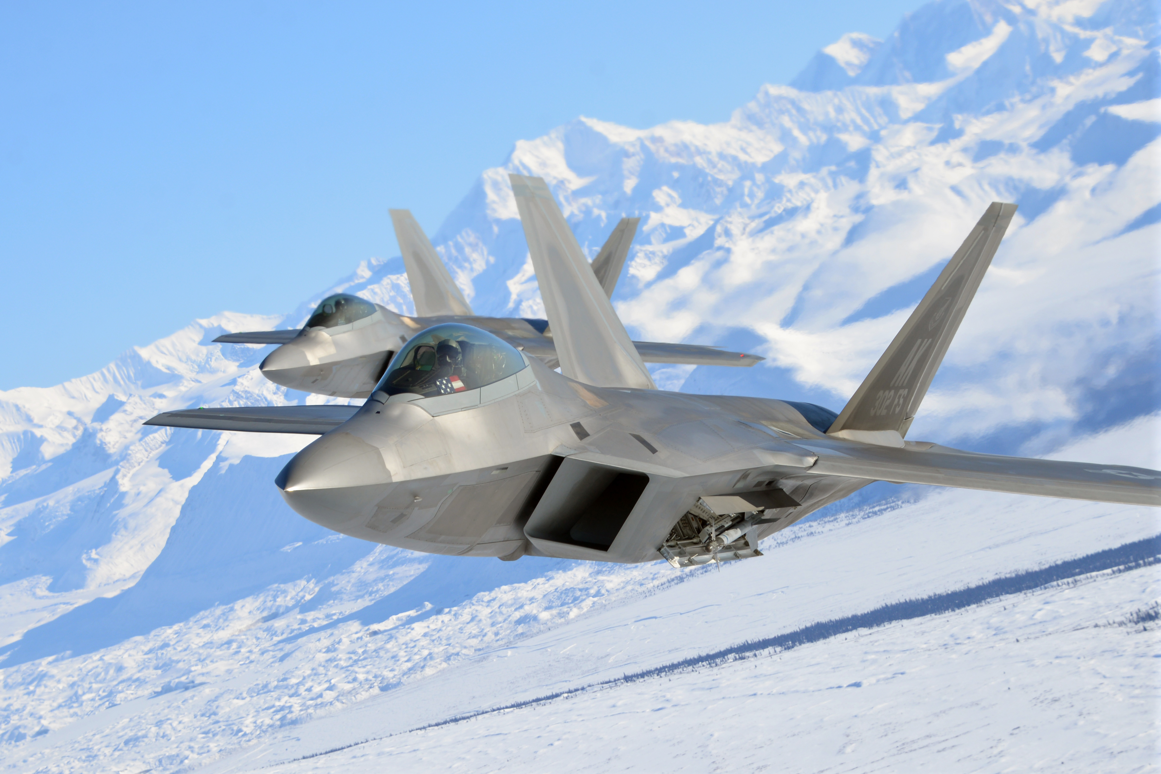 Photo of a USAF F-22 Raptor jet in the sky